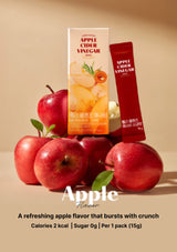 Apple cider vinegar packets with red apples on a beige background