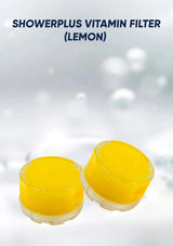 Two yellow shower filters labeled 'Showerplus Vitamin Filter (Lemon)' on a light gray background.