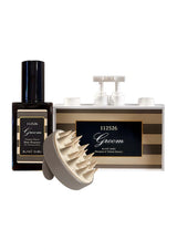 Grooming products including a bottle, brush, and wall-mounted station on a white background