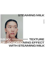 Advertisement for 'Steaming Milk' with a person touching their face on a white background.