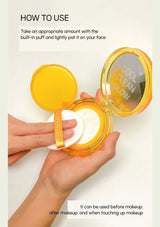 Compact powder with a built-in puff and text on a white background