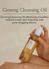 Hand holding a bottle of Ginseng Cleansing Oil with text about its benefits on a beige background