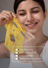 Woman applying a yellow face mask with text highlighting features on a gray background