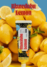 Blancedubu Lemon ice cream popsicle surrounded by lemons with a blue background