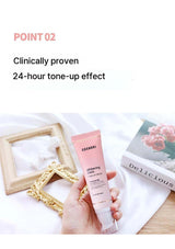 Hand holding a pink skincare tube with text about clinical proven 24-hour tone-up effect on a light background.