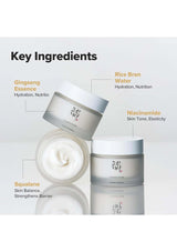 Two skincare cream jars with key ingredients listed on a light gray background