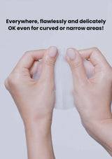 Two hands holding a small object against a light gray background with text overlay.