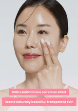 Woman touching her face with a text overlay about tone correction effect