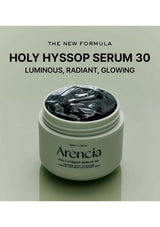 Jar of Arencia Holy Hyssop Serum 30 on a light green background with text about the serum's benefits.
