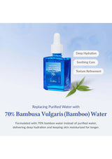 Blue skincare serum bottle with bamboo leaves on a light blue background