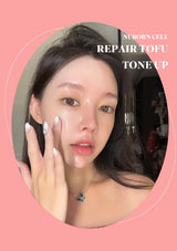 Woman applying a product to her face with text 'Nuborn Cell Repair Tofu Tone Up' on a pink background