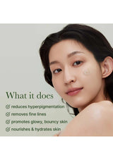 Woman with skin care product on face against a light gray background