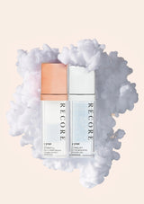 Two skincare products labeled 'RECORE' on a white background with cloud-like texture.