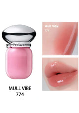 Pink lip gloss with 'Mull Vibe 774' label, close-up of lip color on a white background.