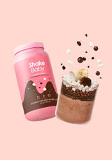 Pink 'Shake Baby' container with a layered dessert shake on a pink background