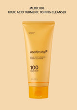 Medicube Kojic Acid Turmeric Toning Cleanser tube on a beige background