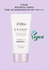 d'Alba UV Essence Tone-Up sunscreen tube on a light purple background