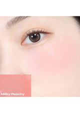 A collection of Alternative Stereo Balmy Cream Cheek products in various shades, displayed against a pink background.