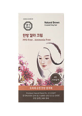 Product packaging for hair dye with a woman's face and floral design on a white background