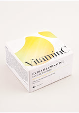 A box of K-Secret Extra Illuminating Eye Gel Patches with Vitamin C, showing the product name and patches in yellow color with a golden spatula.