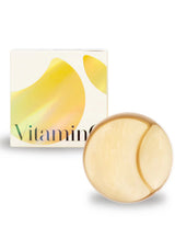 A box of K-Secret Extra Illuminating Eye Gel Patches with Vitamin C, showing the product name and patches in yellow color with a golden spatula.