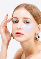 Packaging of K-Secret Instant Relief Eye Gel Patches with Caffeine. The box is predominantly white with a picture of the blue and pink gel patches used for the eyes, and text detailing the product name and key ingredient, Caffeine.