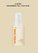 K Secret skincare serum bottle on a beige background