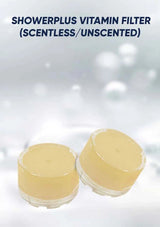 Two containers of Showerplus Vitamin Filter on a light gray background