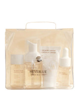 HEVEBLUE Salmon Caring Centella Special Travel Kit, including a bubble cleanser, toner, ampoule, and cream in a transparent plastic packaging with a handle.