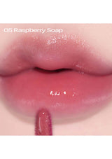 An image showcasing the Alternative Stereo Lip Potion Aqua Glow in 9 different shades, with bottles arranged in two rows. The shades range from pink to red and purple, representing the available color variations of the product.