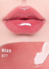 Close-up of pink lipstick on lips with 'Rizz 877' text on a pink background