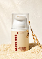 Skincare cream jar labeled 'Seoul 1988' on a textured beige surface with a light background.