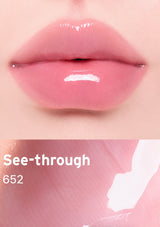 Close-up of pink lips with a transparent lip balm labeled 'See-through 652' on a pink background.