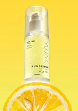 Skincare serum bottle with lemon slice on a yellow background