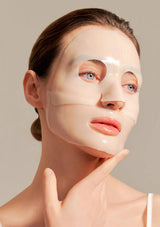 Woman wearing a face mask with a neutral background