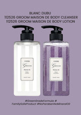 Two bottles of Blanc Dubu Groom Maison de Body products on a purple background