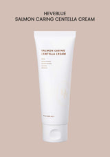 A tube of HEVEBLUE Salmon Caring Centella Cream against a beige background.