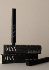 Black hair crayon with packaging on a beige background