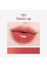 Close-up of a lip with a shade labeled '737 Times' up on a white background