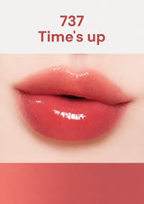 Close-up of a lip with a shade labeled '737 Times' up on a white background