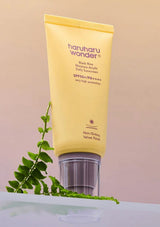 HARUHARU WONDER Black Rice Moisture Airyfit Sunscreen SPF50+/PA++++ on brown background