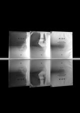Six AIDA skincare masks arranged in two rows on a black background