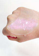 A box of K-SECRET Advanced Regenerating Eye Gel Patches with Retinol. The packaging is predominantly pink and white, with text and branding.
