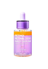 Purito Retinol Retinal 2000 NAD+ Serum in a clear glass dropper bottle with a purple cap and white dropper, featuring an orange and purple label, on a white background.