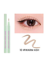 Eyeliner pencil with an eye close-up and 'Warm Ash' color code on a white background