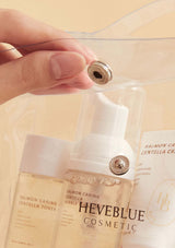 HEVEBLUE Salmon Caring Centella Special Travel Kit, including a bubble cleanser, toner, ampoule, and cream in a transparent plastic packaging with a handle.
