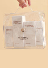 HEVEBLUE Salmon Caring Centella Special Travel Kit, including a bubble cleanser, toner, ampoule, and cream in a transparent plastic packaging with a handle.