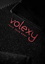 Black textured surface with red 'volexy' logo and text.