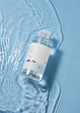 Bottle with a label floating on water