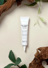 Tube of Nots Centella Scar Ointment on a light background with natural elements